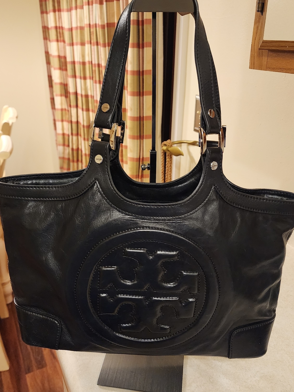 Tory Burch Classic Bombe tote handbag With embossed logo on a black leather Tote